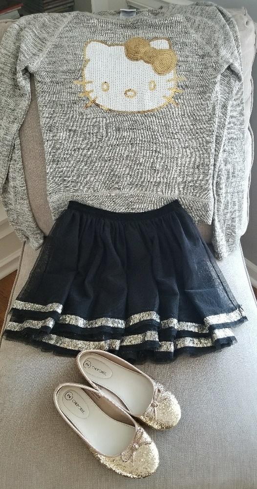 Hello kitty sweater/black cherokee skirt/gold shoe